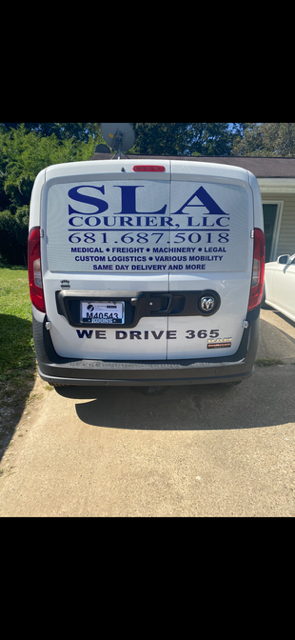 The back of a white cargo van with blue lettering that says SLA Courier, LLC 681.687.5018 and details about the items the company can haul. The tagline, We drive 365, is in black at bottom of the van door.
